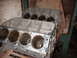 1970 Ford Mustang - Two bare engine blocks are shown in a workshop setting, ready for assembly or rebuilding.