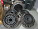 1991 Ford Bronco - A collection of five Ford Bronco wheels, each a distinctive ribbed rim design.
