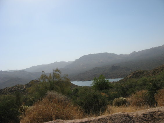Hazy mountain landscape with a lake in the distance