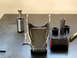 1996 Ford Bronco - Various automotive suspension components laid out on a metal surface.