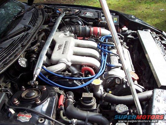 Engine bay with V6 DOHC 24 VALVE engine and strut bar