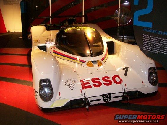 White Peugeot 905 race car with red ESSO livery and number 7, front view