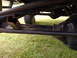 1982 Ford F-100 - Close-up of vehicle undercarriage components, including the differential and axle. Watermark reads SUPERMOTORS.NET.