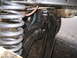 1979 Ford Bronco - This image shows the undercarriage of a vehicle, focusing on the suspension system and axle components.
