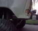 1979 Ford Bronco - Close-up of an off-road vehicle's suspension and tire, showing aftermarket modifications.