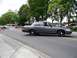 2000 Ford Crown Victoria - A gray 2000 Ford Crown Victoria passes a temporary road closure during a parade.