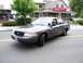 2000 Ford Crown Victoria - This gray 2000 Ford Crown Victoria was seen participating in a parade.