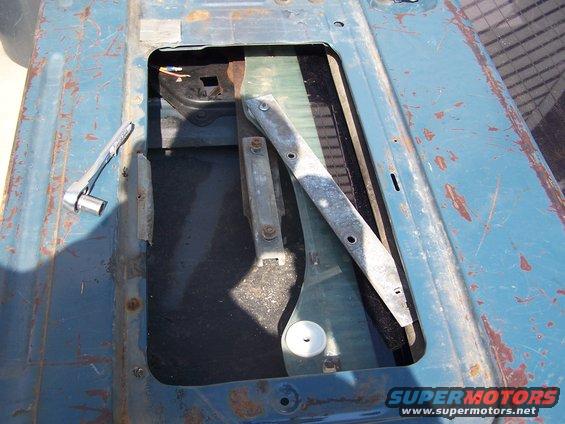 Tailgate interior with window mechanism and socket wrench
