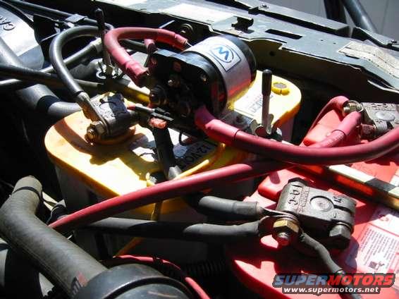 img_0006.jpg Here's a back view of the solenoid, showing the connections.  The solenoid is controlled by a 3 way toggle switch: 1) both charge with engine on, isolated with engine off 2) both batteries on  3) batteries isolated.