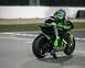 1994 Ford Probe - Racer on a green Kawasaki motorcycle on a race track.
