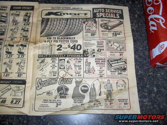 Kmart advertisement page showing tires, auto parts, sporting goods, and vitamin specials