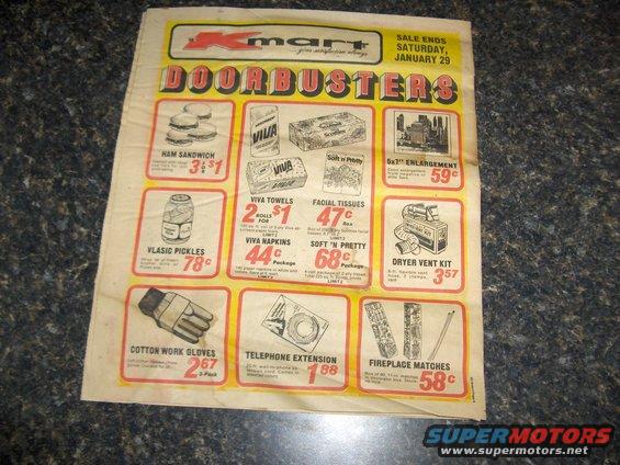 Kmart Doorbuster ad showing ham sandwiches, Vlasic pickles, Viva towels, facial tissues, dryer vent kit, cotton work gloves, telephone extension, and fireplace matches