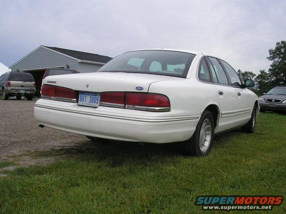 Rear view of a white 1996 Ford Crown Victoria with license plate BVT 3809