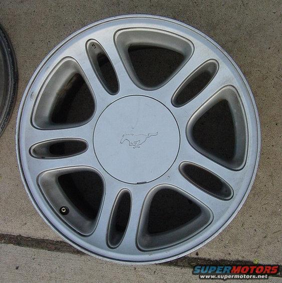 Silver wheel with running horse emblem