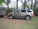 2004 Dodge Durango - A 2004 Dodge Durango is parked in a campsite next to a pickup truck and an RV.