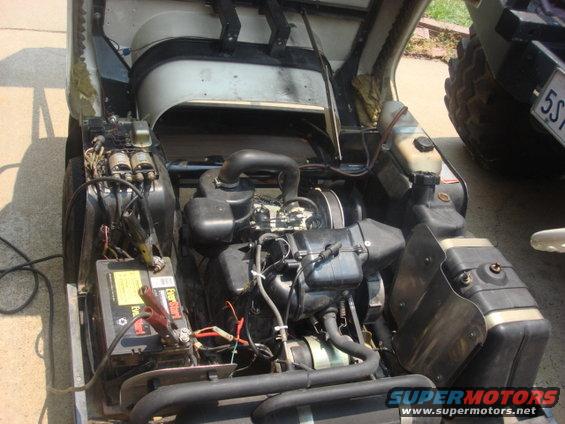 cart-as-we-started-the-wire-cleanup.jpg I poped the cover and saw a wiring mess. i needed to charge the battery and add a new protected light power and a new horn circuit.this is how she looked when i started.