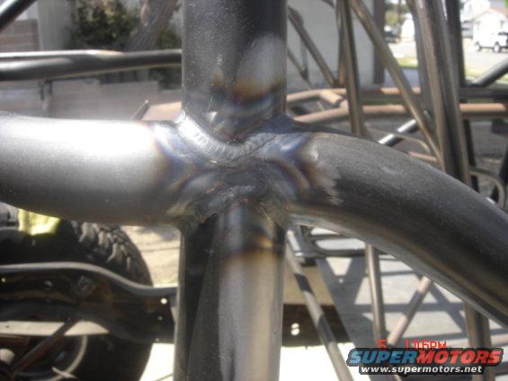 Close-up of welded steel tubing forming a roll cage or frame structure