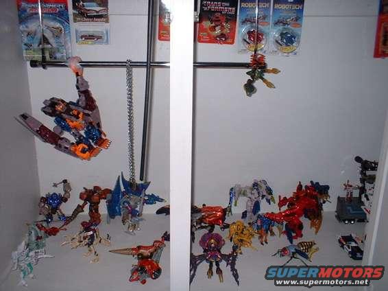 Collection of Transformers toys displayed on shelves