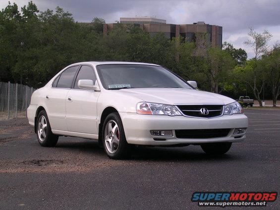White 2003 Acura TL sedan parked on asphalt, front 3/4 view