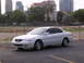 2003 Acura TL - White 2003 Acura TL sedan parked outdoors with urban buildings in the distance.