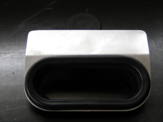Metal part with black rubber trim