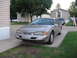 1995 Ford Thunderbird - This silver coupe appears to be a 1994 Ford Thunderbird, not a 1995 model, based on its body style.