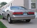 1995 Ford Thunderbird - Rear view of a 1995 Ford Thunderbird LX parked in front of a mobile home.
