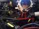 1998 Ford Taurus - Close-up view of engine hoses and manifold, with text indicating '2 Bottom Hoses'.
