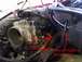 1998 Ford Taurus - Close-up view of engine components, including the throttle body and manifold, with instructional arrows and text.
