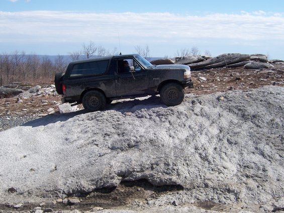 Black Ford Bronco on rocky terrain