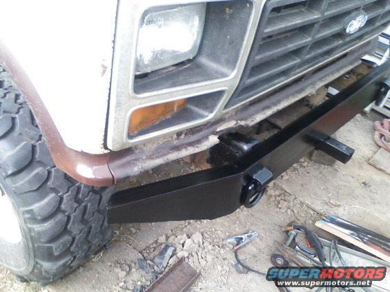 Front grille and fender of a vehicle. Looks like it might be an older model