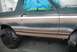 1996 Ford Bronco - Side view of a 1996 Ford Bronco undergoing a paint job, showing the two-tone color application.