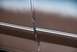 1996 Ford Bronco - Detail of a car door seam, showing pinstripes and the gap between panels.