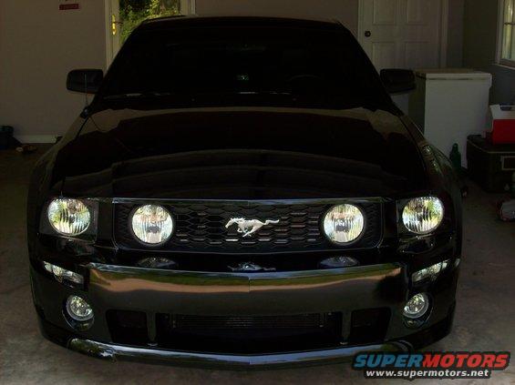 Black 2007 Ford Mustang front view with honeycomb grille and running horse emblem