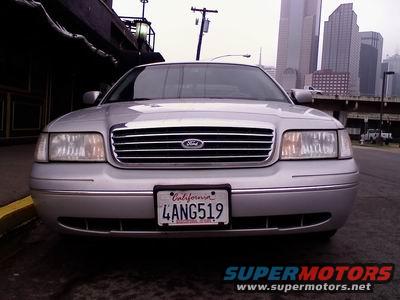1998 Ford Crown Victoria front grille and headlights, silver paint, California license plate 4ANG519