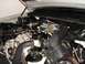 1998 Ford Crown Victoria - Close-up view of a vehicle's engine bay, showing various components and hoses.