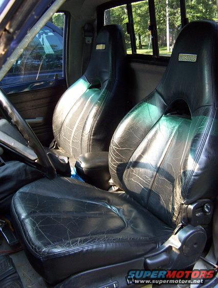 Interior with black leather bucket seats Momo logos