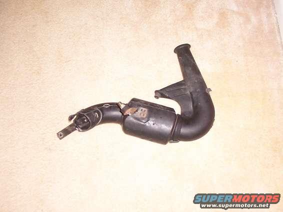 Black plastic air intake hose with a metal clamp and some rust