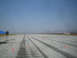 1985 Ford Mustang - Autocross event setup on a paved track with cones marking the course.