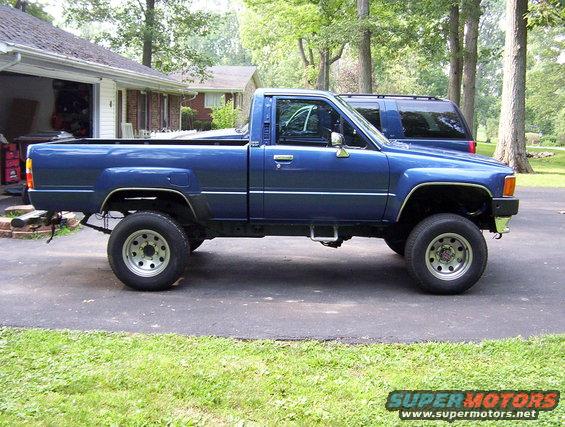 Blue 1986 Toyota Hilux pickup truck, side view