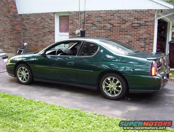 Green 2002 Chevrolet Monte Carlo coupe parked on driveway