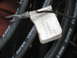 1964 Chevrolet Corvette - A white tag is attached to a collection of dark metal vehicle parts.