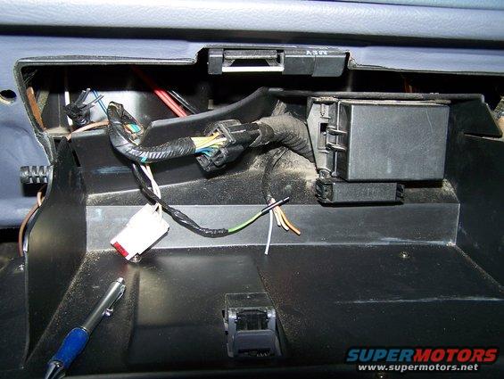 Auxiliary fuse box in the glove compartment