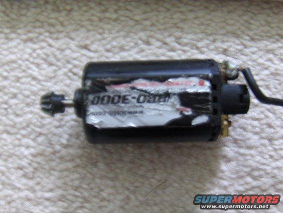 Black electric motor with labels, one reading "000E-03000"