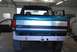 1996 Ford Bronco - The rear of a Ford Bronco is shown in a garage, with its doors open and a tow hitch installed.