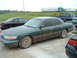1995 Mercury Grand Marquis - This 1995 Mercury Grand Marquis is seen covered in mud, suggesting it has been driven off-road.
