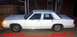 1991 Ford Crown Victoria LTD - This white sedan is parked outdoors with a wooden fence in the background and a 'For Sale' sign visible.