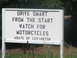 2006 Victory Kingpin - A white sign with black lettering provides a safety message about watching for motorcycles.