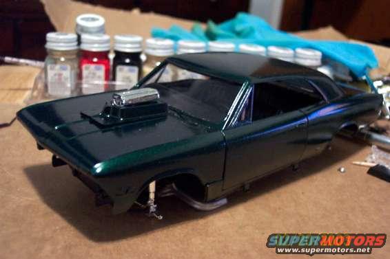 model car with hood scoop and unfinished chassis
