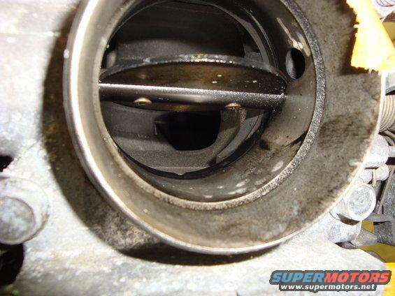 looking into the throttle body. looks good from here and i can tell the intake is more geared towards perfomance than the old one. also very clean inside